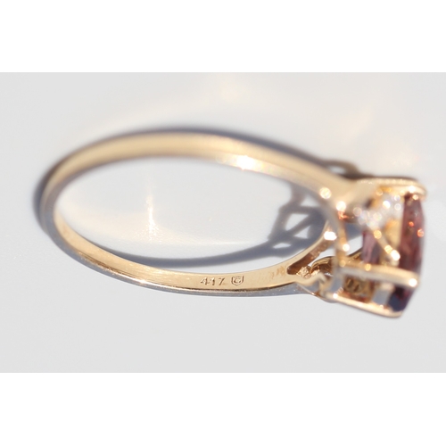 36 - Attractively Detailed, Rhodolite Tourmaline Set Ring with Diamond Inset Ribbon Motif Shoulders, Moun... 