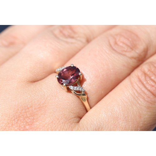 36 - Attractively Detailed, Rhodolite Tourmaline Set Ring with Diamond Inset Ribbon Motif Shoulders, Moun... 