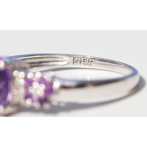 42 - Amethyst Set Ring with Further Amethyst and Diamond Set Daisy Clusters to Shoulders, Mounted in 9 Ca... 