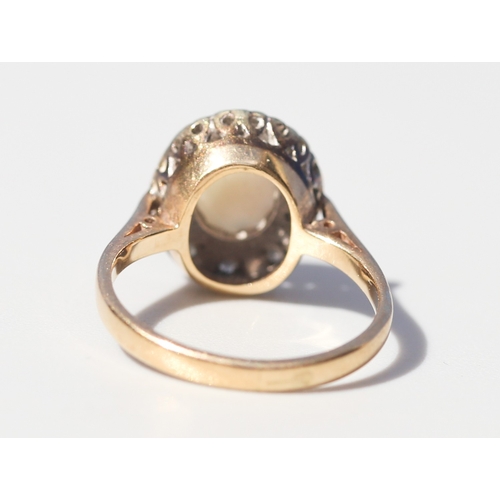 44 - Opal Set Ring with Diamond Inset Surround Mounted in 9 Carat Yellow Gold Ring Size K and a Half