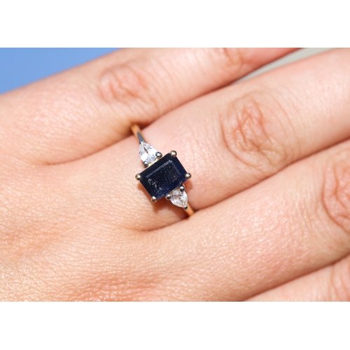 56 - Emerald Cut Sapphire Set Ring with Pear Cut White Sapphire Set to Shoulders, Mounted in 9 Carat Yell... 