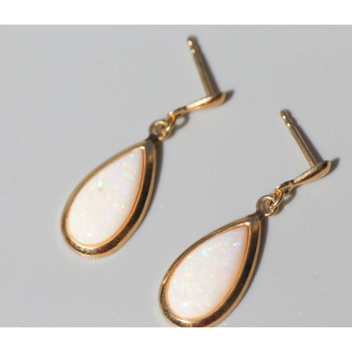 59 - Pair of Pear Cut Opal Set Drop Earrings, Mounted in 9 Carat Yellow Gold 2cm Drop