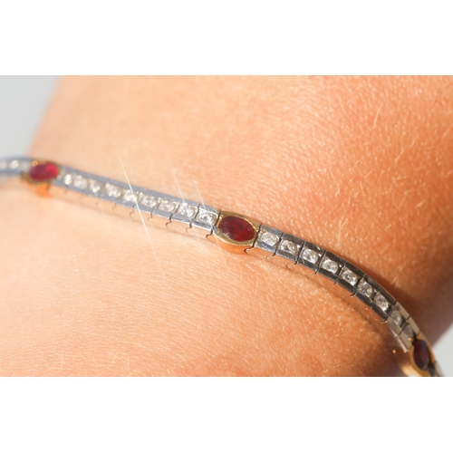 9 - Finely Detailed, Brilliant Cut Diamond Channel Set Bracelet with Six Stone Oval Cut Ruby Inset, Moun... 