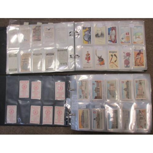 8 - Coln. of mainly part sets and type cards, in 4 albums, in variable cond., incl. Adkin Character Sket... 