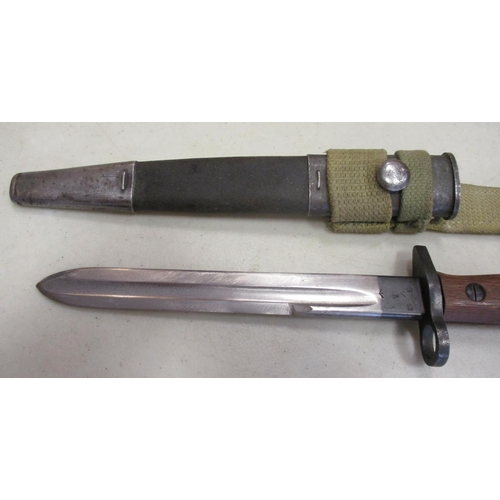 107 - 1907 Pattern shortened and modified bayonets with leather scabbards:
1. Enfield, ricasso marked crow... 