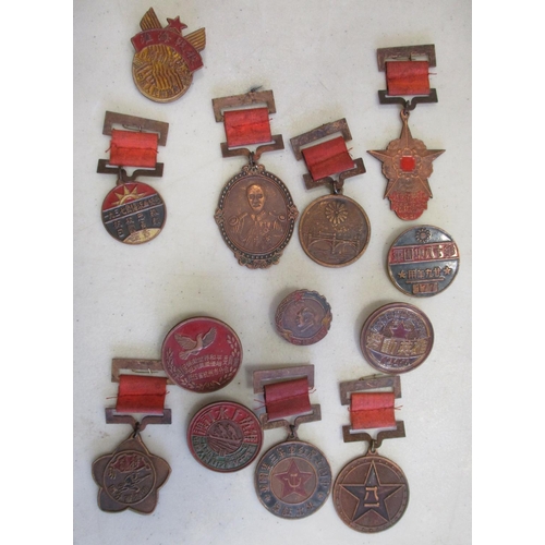 83 - China. Collection of medals and badges, mainly from 1940s-60s, some dated, most with enamel, in mixe... 