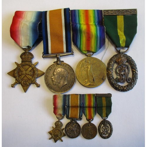 171 - 1914-15 Star trio and KGV Territorial Decoration (with oakleaf suspension bar) to Capt J. Woodman-Sm... 