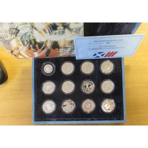 591 - 1986 'XIII Commonwealth Games' set of 12 silver cased proofs with Royal Mint certificate. (½B)