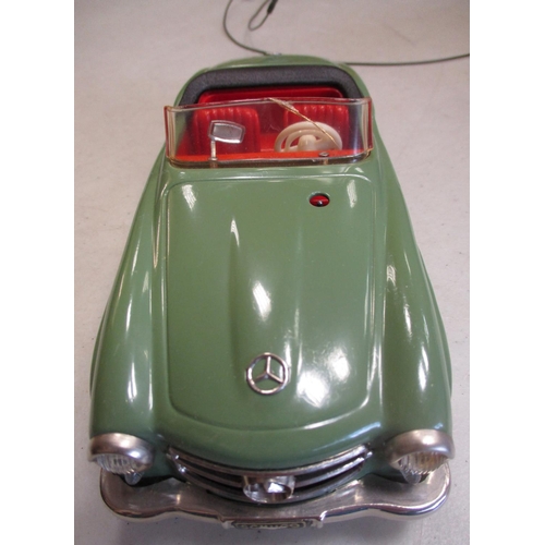 224 - Schuco. Tinplate clockwork self steer Mercedes 190SL No 2095, green body, red interior, windscreen w... 