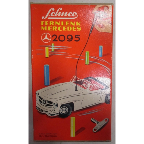 224 - Schuco. Tinplate clockwork self steer Mercedes 190SL No 2095, green body, red interior, windscreen w... 