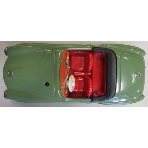 224 - Schuco. Tinplate clockwork self steer Mercedes 190SL No 2095, green body, red interior, windscreen w... 