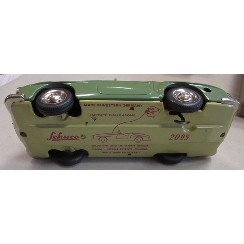 224 - Schuco. Tinplate clockwork self steer Mercedes 190SL No 2095, green body, red interior, windscreen w... 