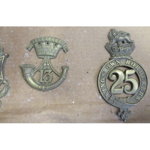 64 - 1874-81 Glengarry badge collection mounted on cardboard with 17th, 75th, 51st, 69th, 5th, 6th etc , ... 