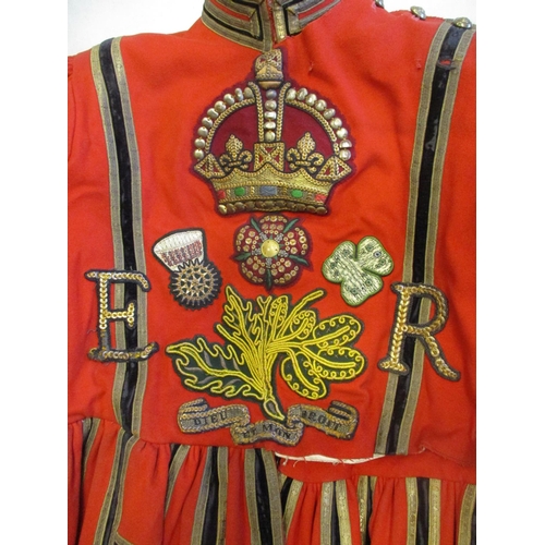 75 - QEII Yeoman Warder's scarlet and gold State Dress tunic, some fraying to the edges, several small ho... 