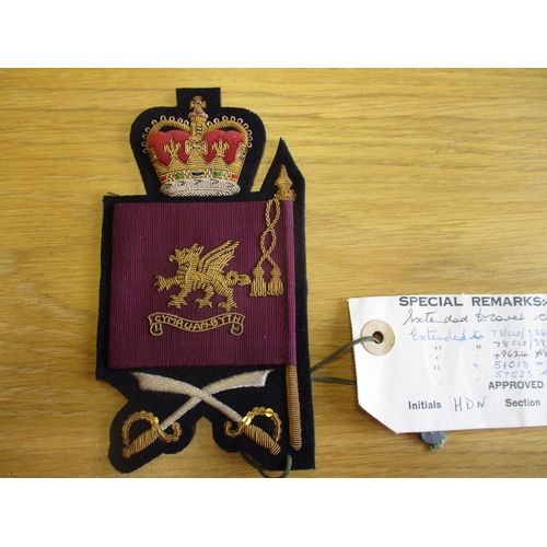 91 - Excellent collection of largely cloth and embroided rank, cap and trade badges, many labelled sample... 