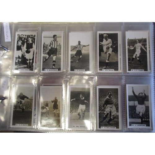 41 - Coln. of football complete and part sets, in an album, in variable cond., incl. Carreras Footballers... 