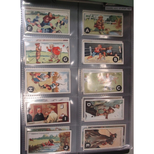 53 - Ogdens. Coln. of complete sets, in 2 albums, in variable cond., incl. A.B.C. of Sport, British Costu... 