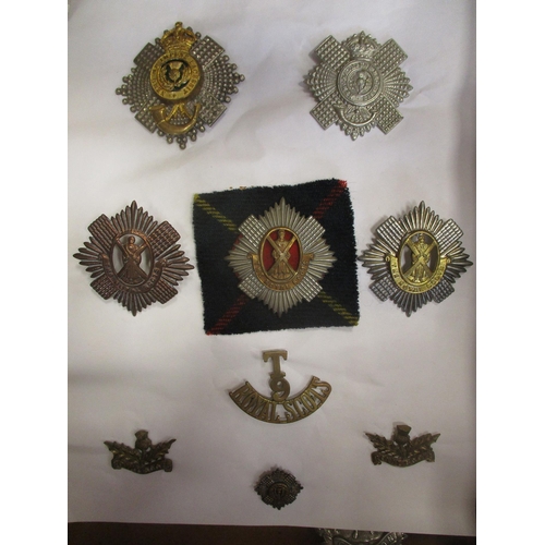 233 - Collection of mostly Scottish Regiments cap badges, shoulder titles, pin badges etc including Royal ... 