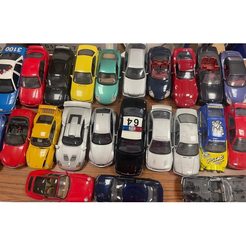 392 - UT Models. Collection with accompanying boxes including 1/18 Ford Escort, Porsche 911 series, Chevro... 