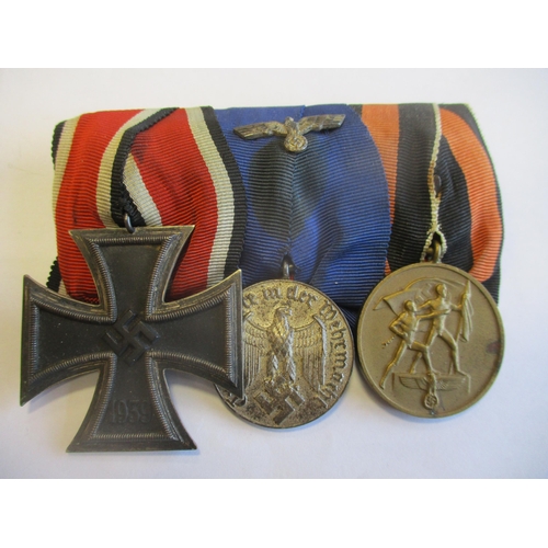 100 - Germany. Third Reich 1939 Iron Cross Second Class, Wehrmacht Long Service Badge (4 Years) and 1 Octo... 