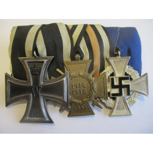 104 - Germany. 1914 Iron Cross Second Class, WW1 Hindenburg Cross and Third Reich Faithful Service Decorat... 