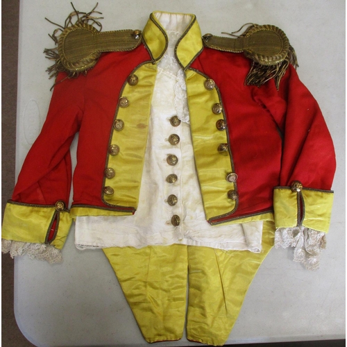 122 - Very detailed child's reproduction uniform in 18th/19th century style with red jacket with yellow cu... 