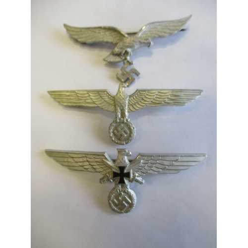 126 - Third Reich range of metal breast eagles with:
1. Gilt, 95mm, reverse stamped Schwerin Berlin 68.
2.... 