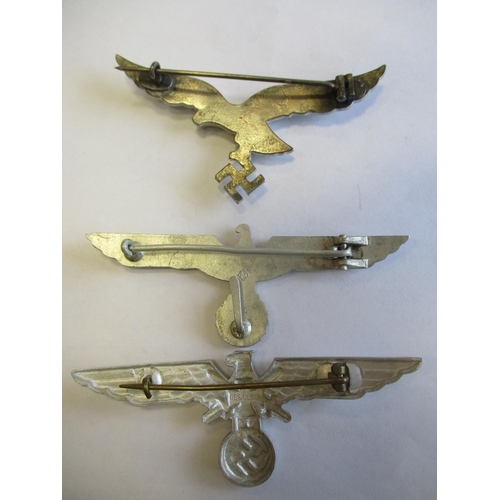 126 - Third Reich range of metal breast eagles with:
1. Gilt, 95mm, reverse stamped Schwerin Berlin 68.
2.... 