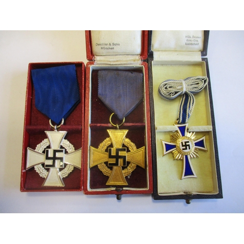 83 - Germany. Third Reich boxed range with:
1. Faithful Service Decoration Second Class, box with C.F. Zi... 