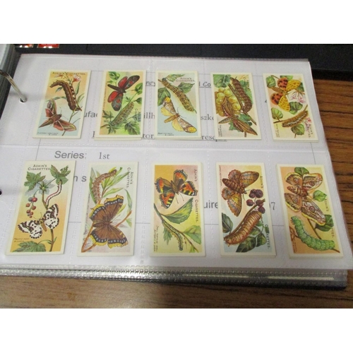 122 - Collection of mainly complete sets in an album, generally mixed condition, including Adkin 1924 Butt... 