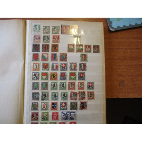 62 - World early to modern M/U coln in 4 albums 2 stockbooks and loose packets. Incl Austria and Switzerl... 