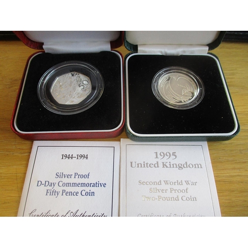 495 - Collection with GB proof cased sets FDC 1970, 81, 82, de-luxe proof cased set 2002, USA 1968 proof s... 