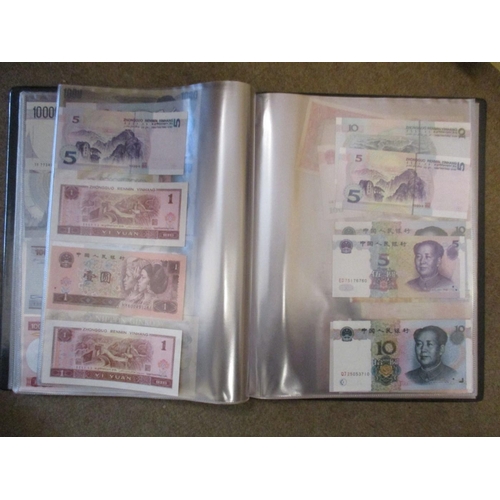 143 - Collection of world banknotes in album, generally very fine to extremely fine, with Brazil, China, I... 