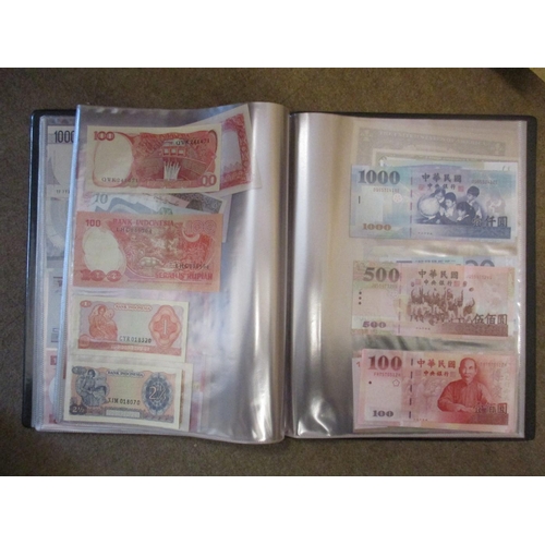 143 - Collection of world banknotes in album, generally very fine to extremely fine, with Brazil, China, I... 