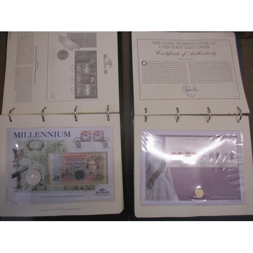 490 - Pair of world coin cover collections of various denominations in 3 folders, with the 2000 'The Mille... 