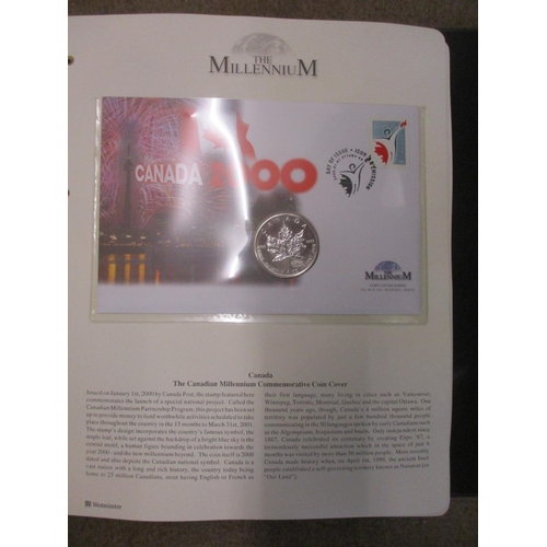 490 - Pair of world coin cover collections of various denominations in 3 folders, with the 2000 'The Mille... 