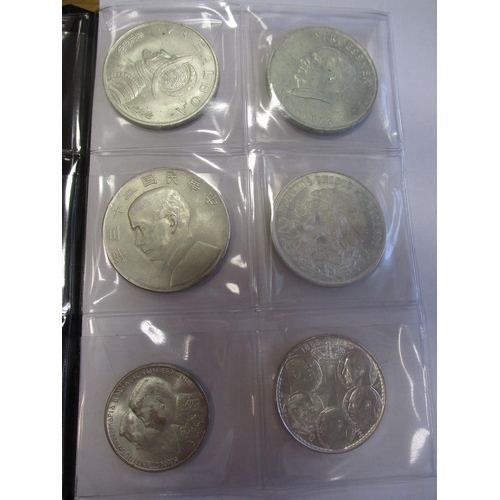 506 - World range in small Schulz coin album, some silver, including China Junk dollar, Maria Theresa thal... 