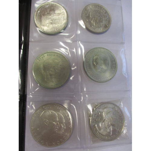 506 - World range in small Schulz coin album, some silver, including China Junk dollar, Maria Theresa thal... 