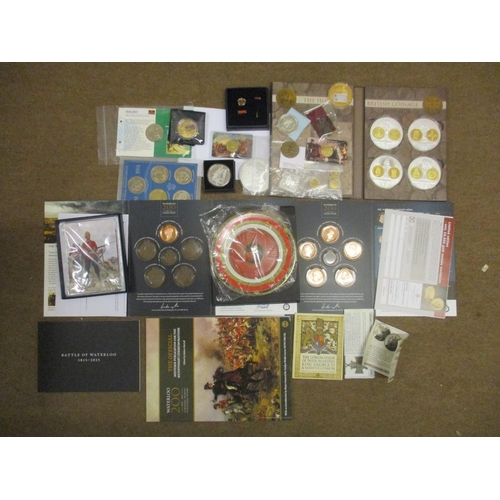 530 - Collection of majority uncirculated world coins on cards or boxed, with Denmark, Gibraltar, GB, Isle... 