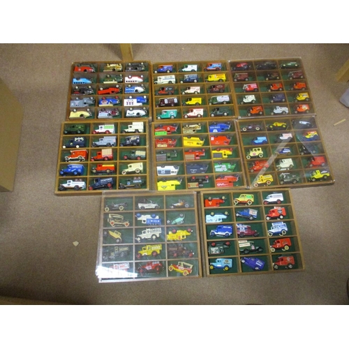 474 - Range of unboxed diecast commercial vehicles in wooden display cases, generally mixed condition, inc... 