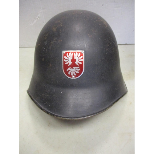 111 - Helmet range all fitted with liners with British WW2 era Brodie with net cover, WW2 Air Raid warden,... 