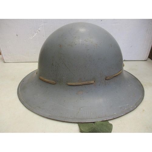 111 - Helmet range all fitted with liners with British WW2 era Brodie with net cover, WW2 Air Raid warden,... 