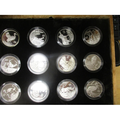 635 - Zambia. 1998 100 Kwacha Wildlife cased set of 12 silver proofs FDC, odd with toning, in plush box by... 