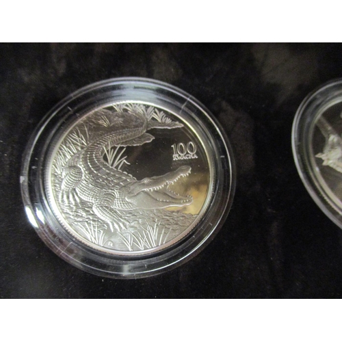 635 - Zambia. 1998 100 Kwacha Wildlife cased set of 12 silver proofs FDC, odd with toning, in plush box by... 