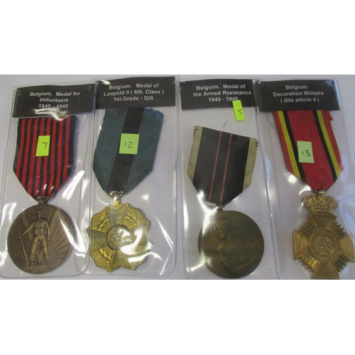 65 - Belgium. Collection including Croix de Guerre with palme, Order of Leopold Officer with crossed swor... 