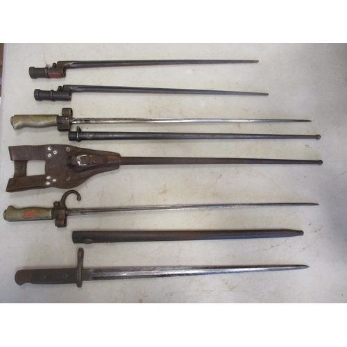 81 - World mainly bayonet range in large wicker basket including Japanese Type 30 with Nagoya Arsenal mar... 