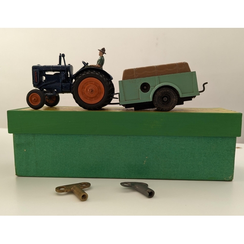 301 - Britains. Clockwork Set - Fordson Major Tractor No. 139F, blue body, orange hubs, driver, clockwork ... 