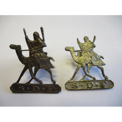 120 - Sudan Defence Force badges, all with running camel  and rider, S.D.F. in tablet below, with 2 silver... 