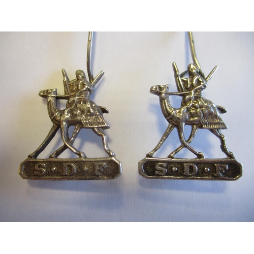 120 - Sudan Defence Force badges, all with running camel  and rider, S.D.F. in tablet below, with 2 silver... 