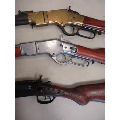 98 - Denix. Reproduction firearms range with:
1. Remington style single shot rifle with brass coloured fr... 